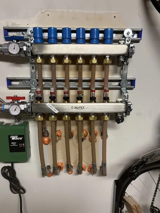 Plumber performing Water Heater Repair at a residential property in Tyngsborough